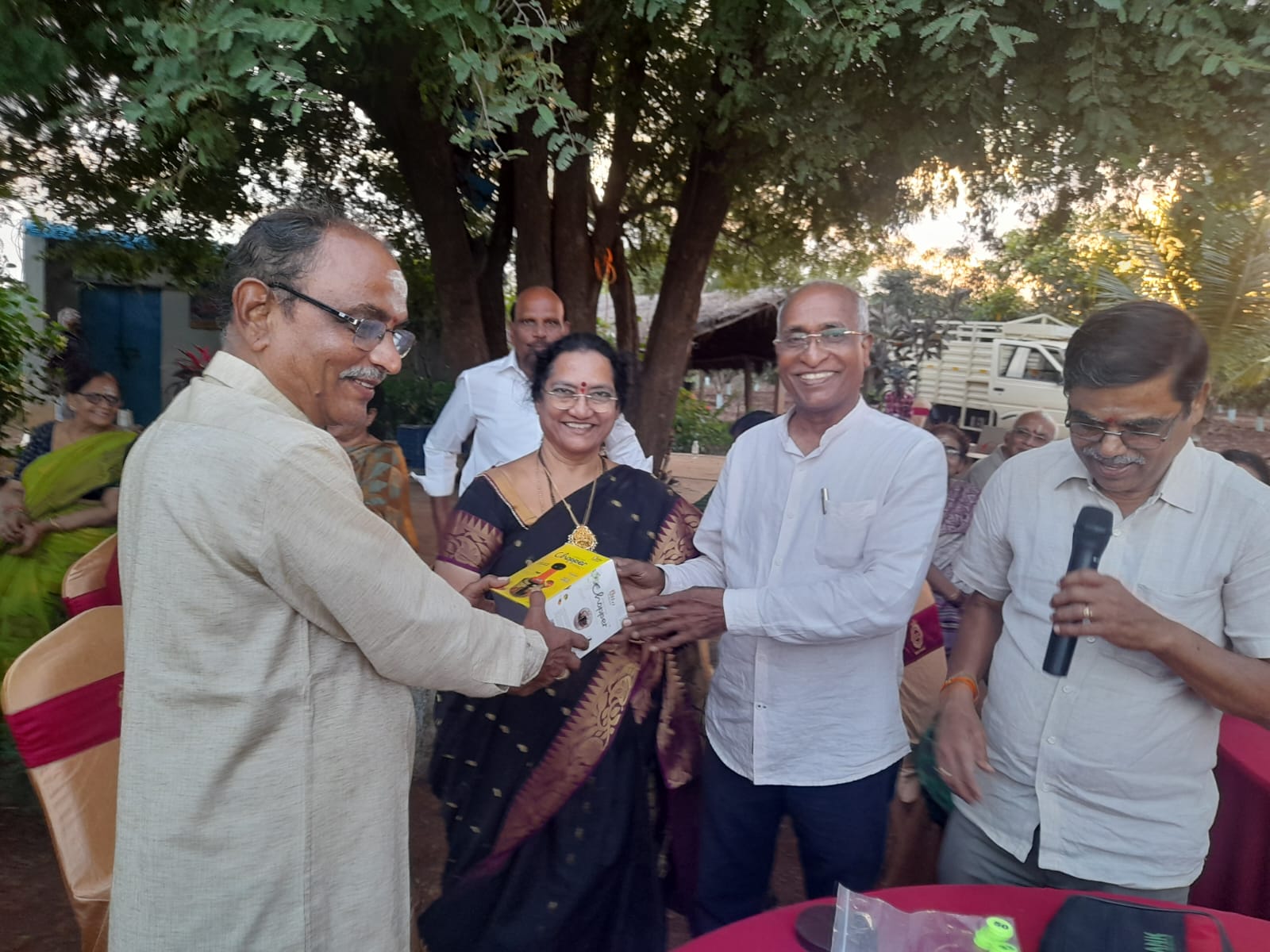 Smt. Rama Sita W/O V. Venu Mohana Rao Garu receiving First prize in singing compitition (Women) in get-together party on 22-11-2023.